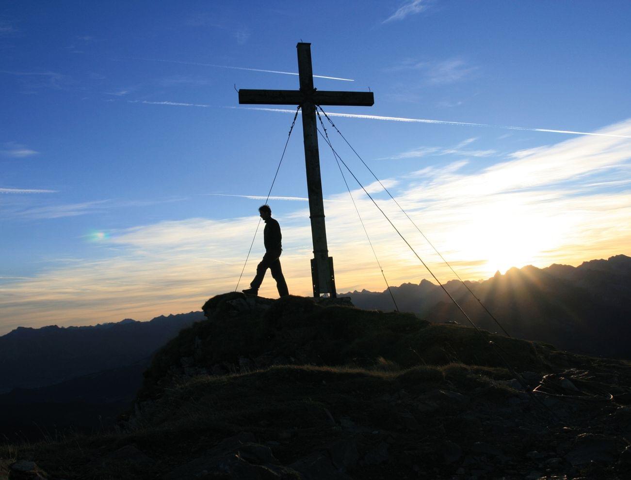 Summit cross on the mountain in the Kleinwalsertal valley